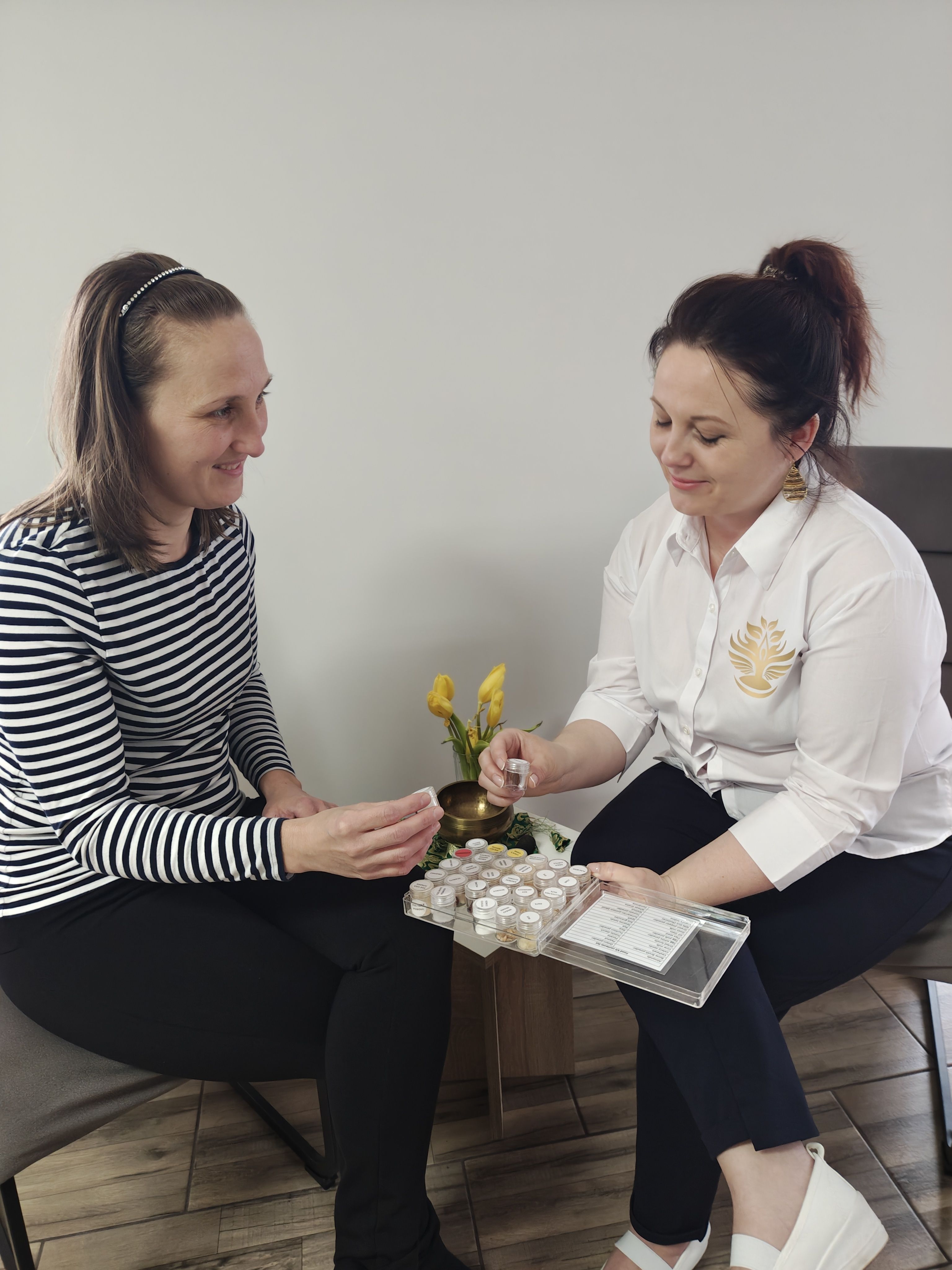 Judit smiling with a client during a consultation